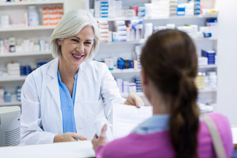 pharmacist giving out medication